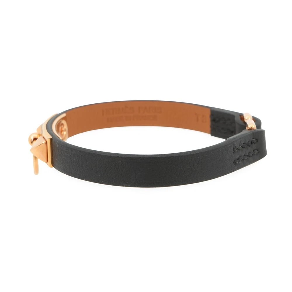 HERMES MINI REVAL BLACK/PINK GOLD SWIFT BRACELET: Hermes Mini Reval Black/Pink Gold Swift Bracelet Brand: Hermes Type/Style: Bracelet Material: Swift leather, Color: Black, Pink Gold Size: T3 (approx. 6.3 inches wrist circumference) Accessories: