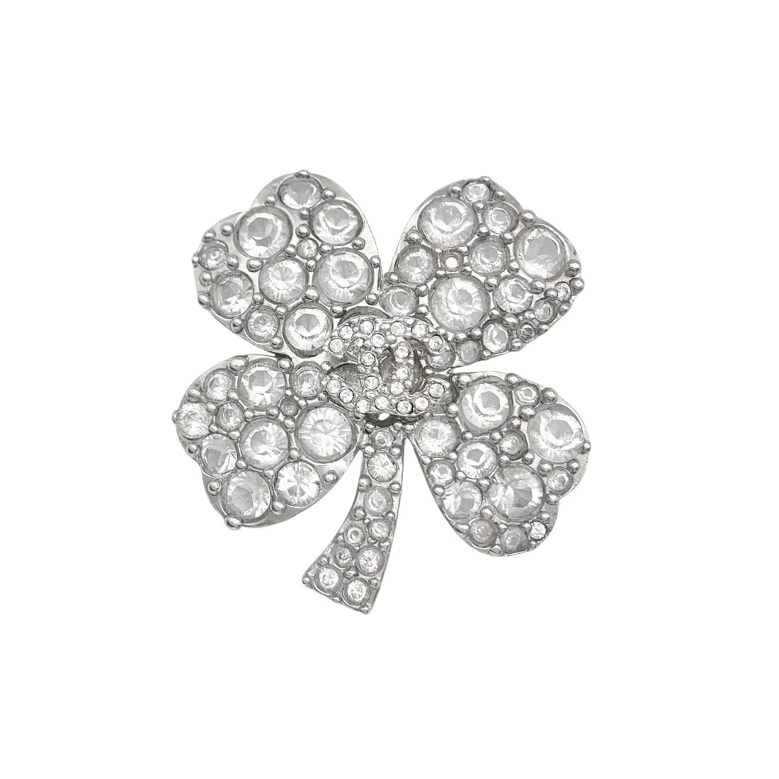 CHANEL RHINESTONE BROOCH SILVER: CHANEL Rhinestone Brooch Silver Brand: Chanel Type/Style: Brooch Material: Silver-plated, Rhinestones, Color: SILVER Size: Dimensions are approximately 1.9 inches (4.9cm) wide and 2.2 inches (5.5cm)