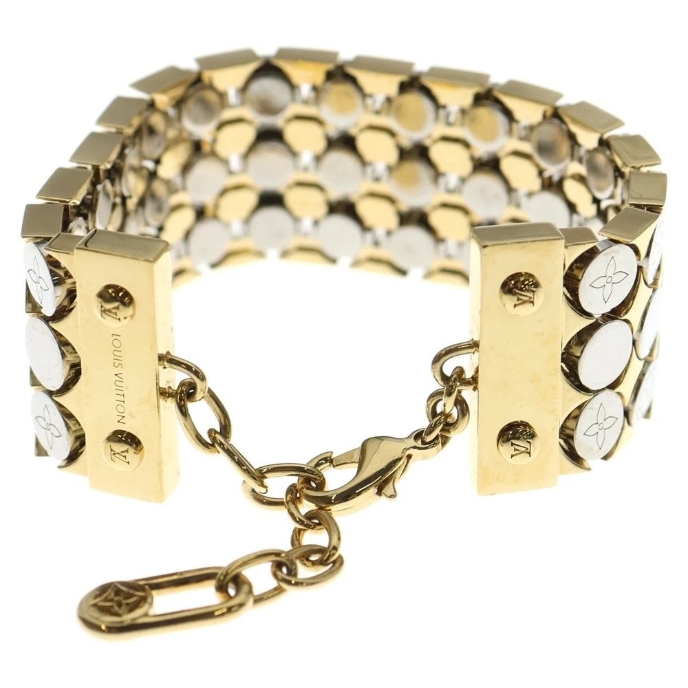LOUIS VUITTON LV FUTURA BRACELET GOLD: Louis Vuitton LV Futura Bracelet Gold Brand: Louis Vuitton Type/Style: Bracelet Material: Not specified, Color: GOLD Size: 8.9 inches; Width: 1.1 inches Accessories: None Accessories Notice: When