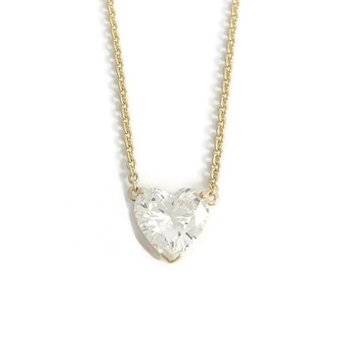 HEART SOLITAIRE DIAMOND PENDANT NECKLACE 14K YELLOW GOLD: Heart Solitaire Diamond Pendant Necklace 14K Yellow Gold Brand: none Type/Style: Necklace Material: 14K Yellow Gold, Main Stone/Creation Natural Color: Gold Size: Length: 16 inches Pendant: 8.5 mm x