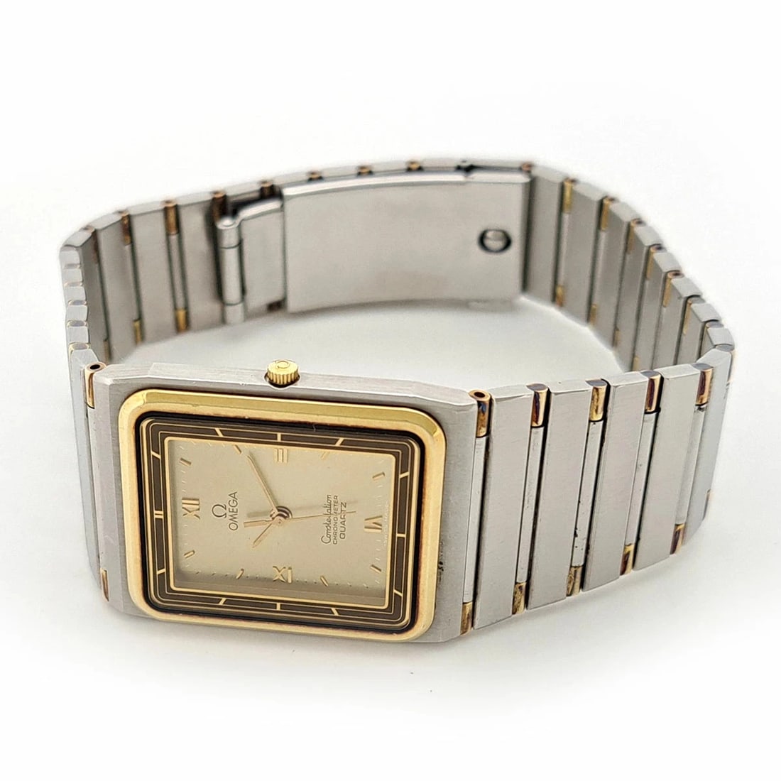 OMEGA CONSTELLATION RECTANGULAR QUARTZ STAINLESS STEEL GOLD PLATED WATCH: Omega Constellation Rectangular Quartz Stainless Steel Gold Plated Watch Brand: Omega Type/Style: Wristwatch Material: Case Material: Stainless Steel with Gold Plating Color: Dial Color chamagne Size: