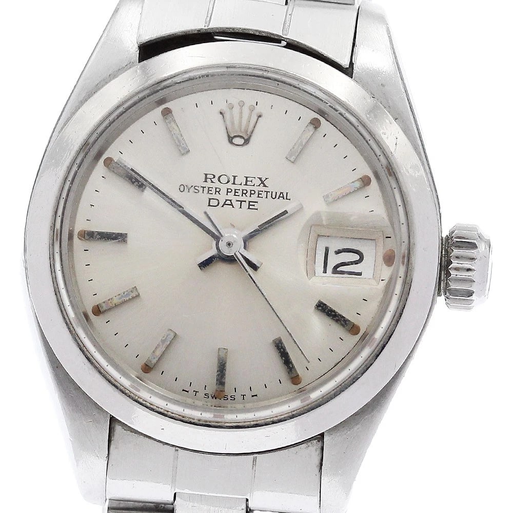 ROLEX OYSTER PERPETUAL DATE LADIES WATCH: ROLEX Oyster Perpetual Date Ladies Watch Brand: ROLEX Type/Style: Wristwatch Material: Band Material Stainless Steel, Case Material Stainless Steel Color: Band Color Silver, Dial Color Silver, Case