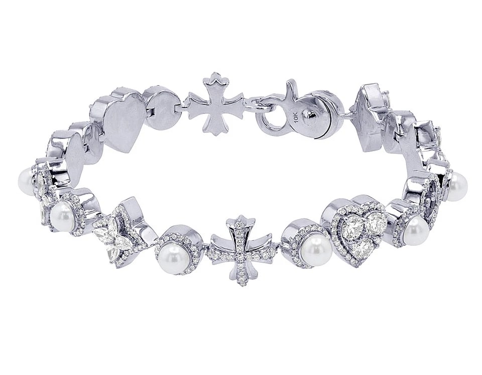 PRISMATIC DIAMOND LINK BRACELET: Prismatic Diamond Link Bracelet Brand: none Type/Style: Bracelet Material: 10K , White Gold, Main Stone/Creation White Color: Natural Size: Length 8.5 in Width 13MM Accessories: None Accessories
