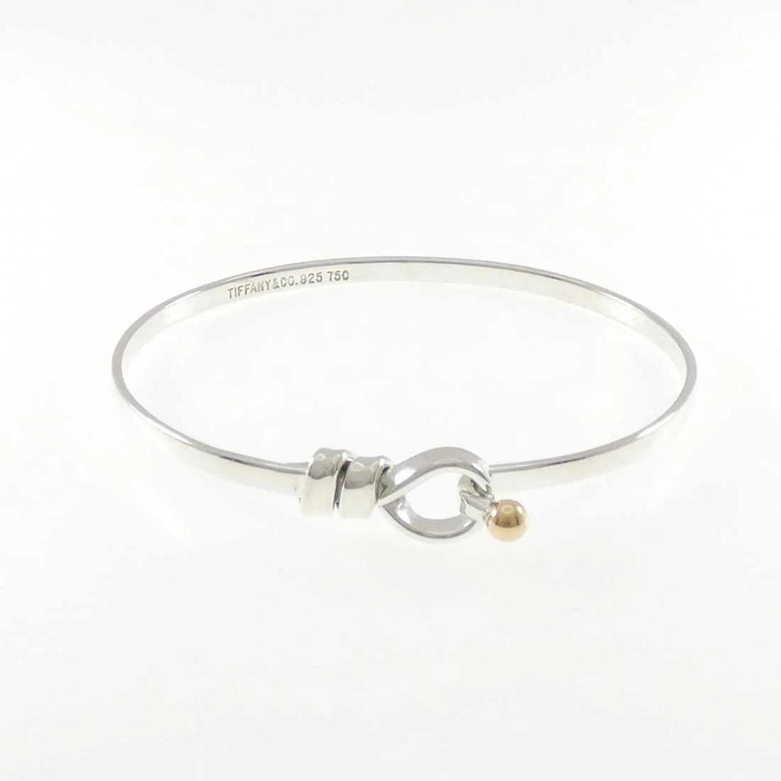 TIFFANY & CO. HOOK & EYE BANGLE: TIFFANY & Co. Hook & Eye Bangle Brand: TIFFANY&Co. Type/Style: TIFFANY & Co. Bracelet Material: 925Silver/750Yellow Gold, Color: silver,Yellow Gold Size: 17cm Actual Size Max width approx: 9.2mmcm