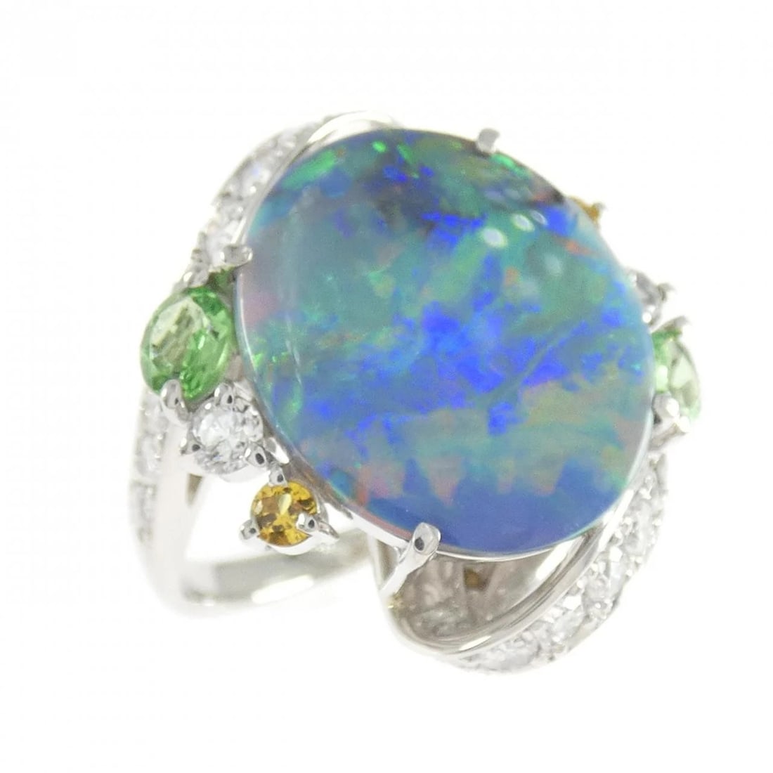 PT900 BLACK OPAL RING: PT900 Black Opal Ring Brand: Unbranded Type/Style: Black Opal Ring Material: PT900, Main Stone/Creation Black Opal Secondary Stone Garnet/Sapphire/Diamond Color: Silver Size: US 5 Accessories: Non