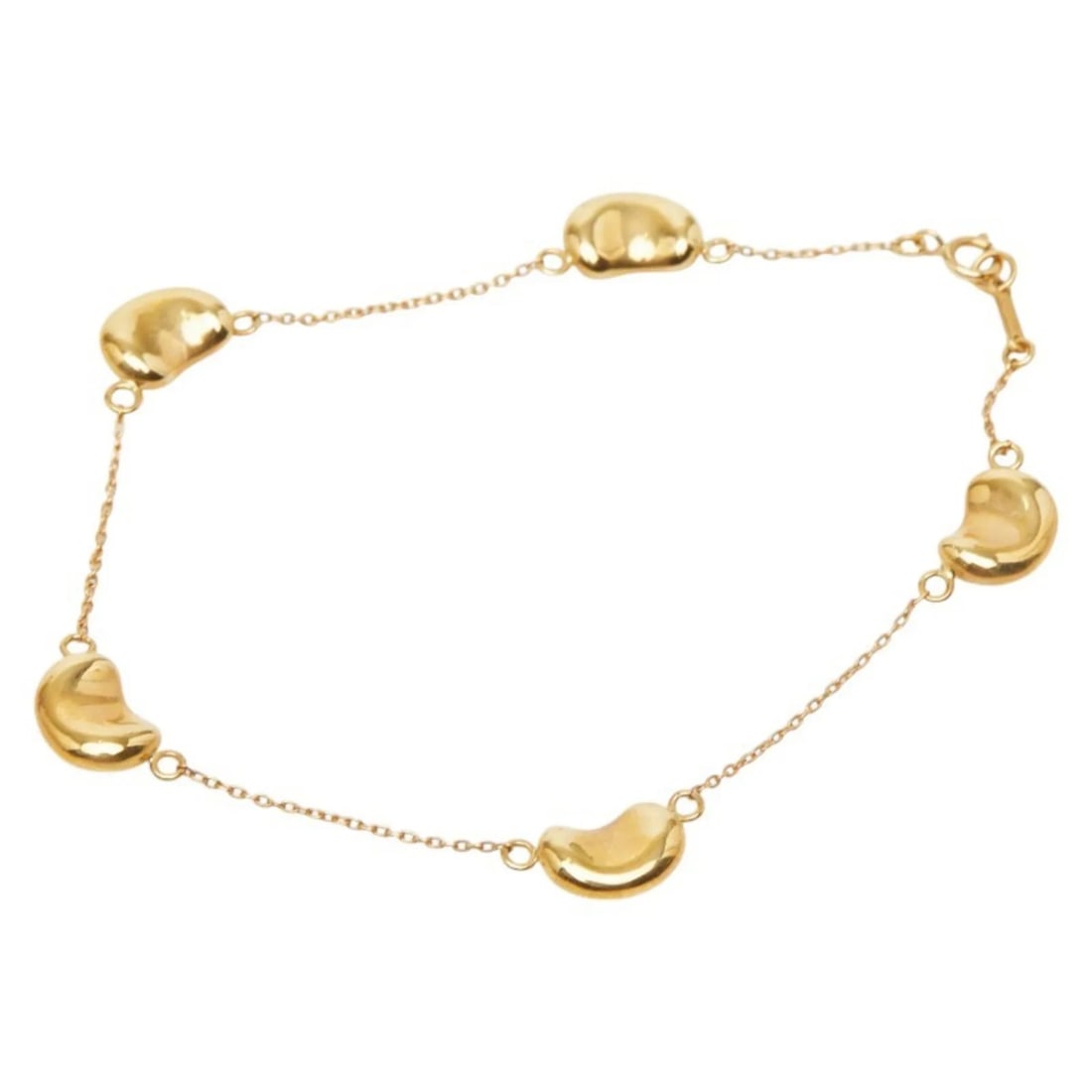TIFFANY & CO. BEANS 5-PIECE BRACELET, 18K YELLOW GOLD: Tiffany & Co. Beans 5-Piece Bracelet, 18K Yellow Gold Brand: Tiffany Type/Style: Charm bracelet Material: Yellow gold (18K) Color: Yellow gold Size: Length 20.5cm / 8.07'' Accessories: None