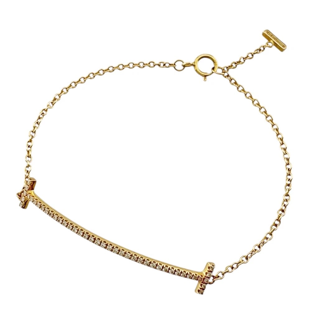TIFFANY&CO. BRACELET K18 YELLOW GOLD DIAMOND T SMILE: TIFFANY&Co. Bracelet K18 yellow gold diamond T Smile Brand: Tiffany&co. Type/Style: Bracelet Material: K18 yellow gold, Main Stone/Creation Natural Color: gold Size: Total Length:16.5cm Chain