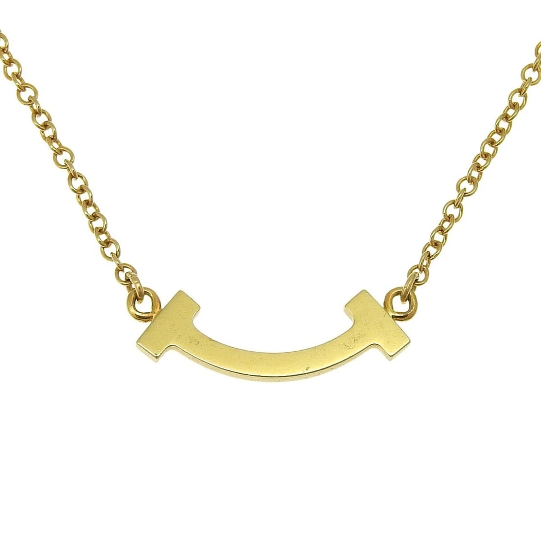 TIFFANY & CO. T SMILE MINI PENDANT NECKLACE: Tiffany & Co. T Smile Mini Pendant Necklace Brand: Tiffany & Co. Type/Style: Necklace Material: K18YG Color: YG Size: Chain Length: Adjustable 15.75?17.72 inches (40/45 cm) Accessories: None