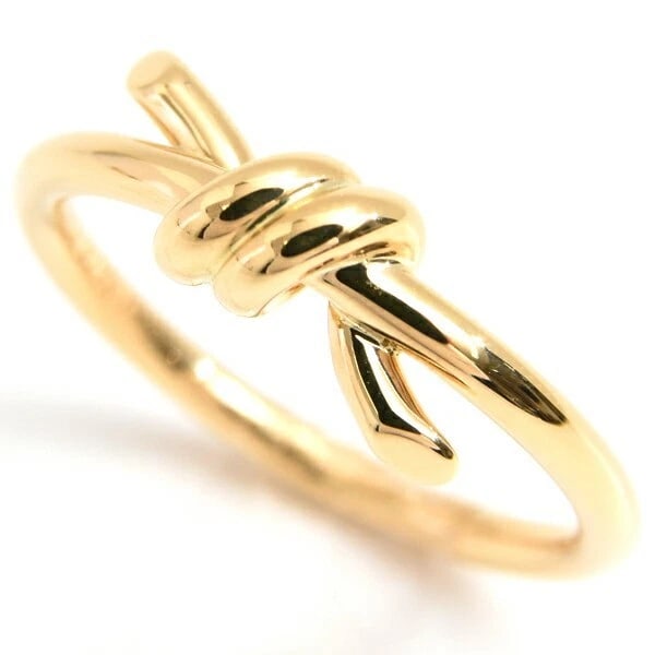 TIFFANY & CO KNOT RING: Tiffany & Co Knot Ring Brand: Tiffany & Co. Type/Style: Ring Material: K18YG Color: YG Size: US: 5.25 Accessories: None Accessories Notice: When purchasing pre-owned goods, please refer to