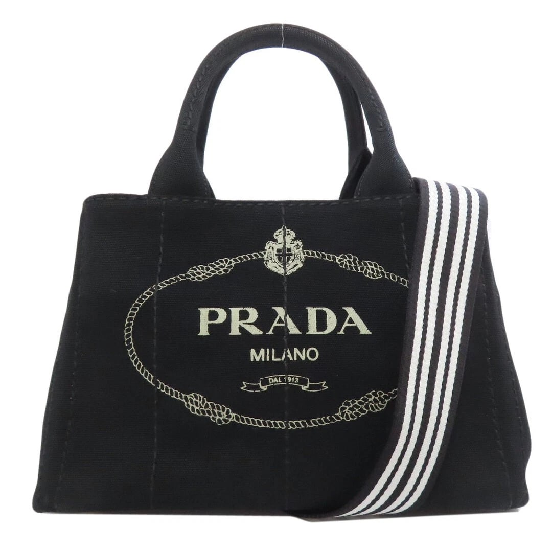 PRADA KANAPA MINI 2WAY CANVAS HANDBAG BLACK USED: Prada Kanapa Mini 2WAY Canvas Handbag Black Used Brand: PRADA Type/Style: Bag Material: Canvas Color: Black Size: Height: 19 cm (7.5 in) Width: 28 cm (11.0 in) Depth: 16 cm (6.3 in) Accessories: N