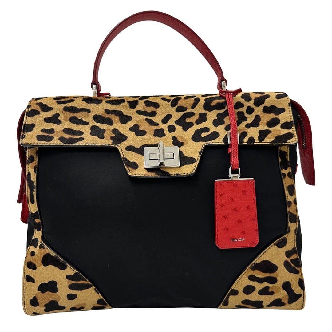 PRADA LEATHER LEOPARD DESIGN HANDBAG: Prada Leather Leopard Design Handbag Brand: PRADA Type/Style: Bag Material: Leather / Hair Calf / Ostrich Leather Color: Black, Red, Yellow Size: Measurets: Width 38 cm (15 in), Height 32 cm (12.6 in)