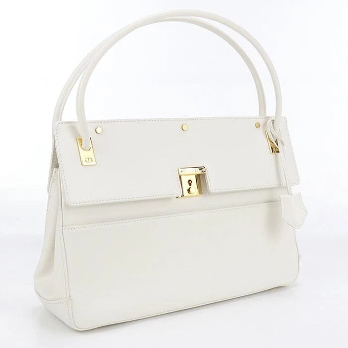 DIOR HANDBAG WHITE LEATHER GOLD HARDWARE: Dior Handbag White Leather Gold Hardware Brand: Dior Type/Style: Bag Material: Leather Color: White Size: 31 cm (12.2 in) W x 21 cm (8.3 in) H x 9 cm (3.5 in) D Accessories: None Accessori