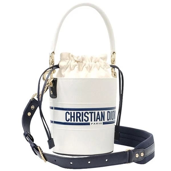 CHRISTIAN DIOR VIBE MICRO BUCKET: Christian Dior Vibe Micro Bucket Brand: CHRISTIAN DIOR Type/Style: Bag Material: Leather Color: White/Navy Size: Height 17 cm (6.7 in), Width 14 cm (5.5 in), Depth 14 cm (5.5 in) Accessories: None