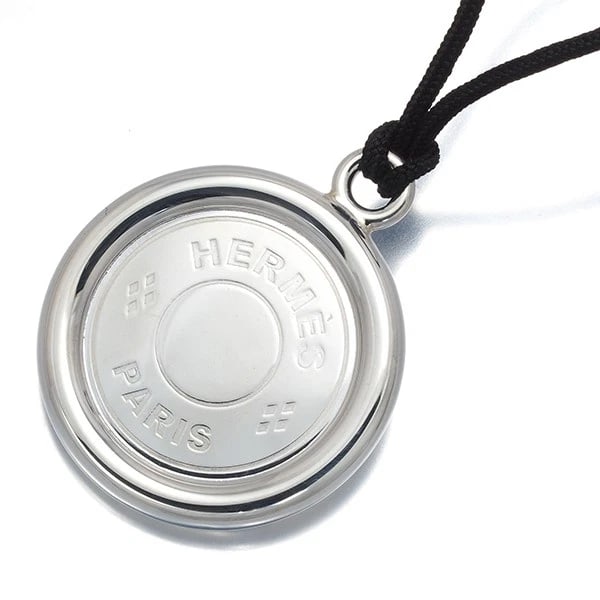 HERMES NECKLACE 925 STERLING SILVER/CORD: HERMES Necklace 925 Sterling Silver/Cord Brand: HERMES Type/Style: Necklace Material: 925 Sterling Silver/Cord Color: Silver Size: Necklace length: 38cm Pendant size: Diameter 29.8mm Total length of