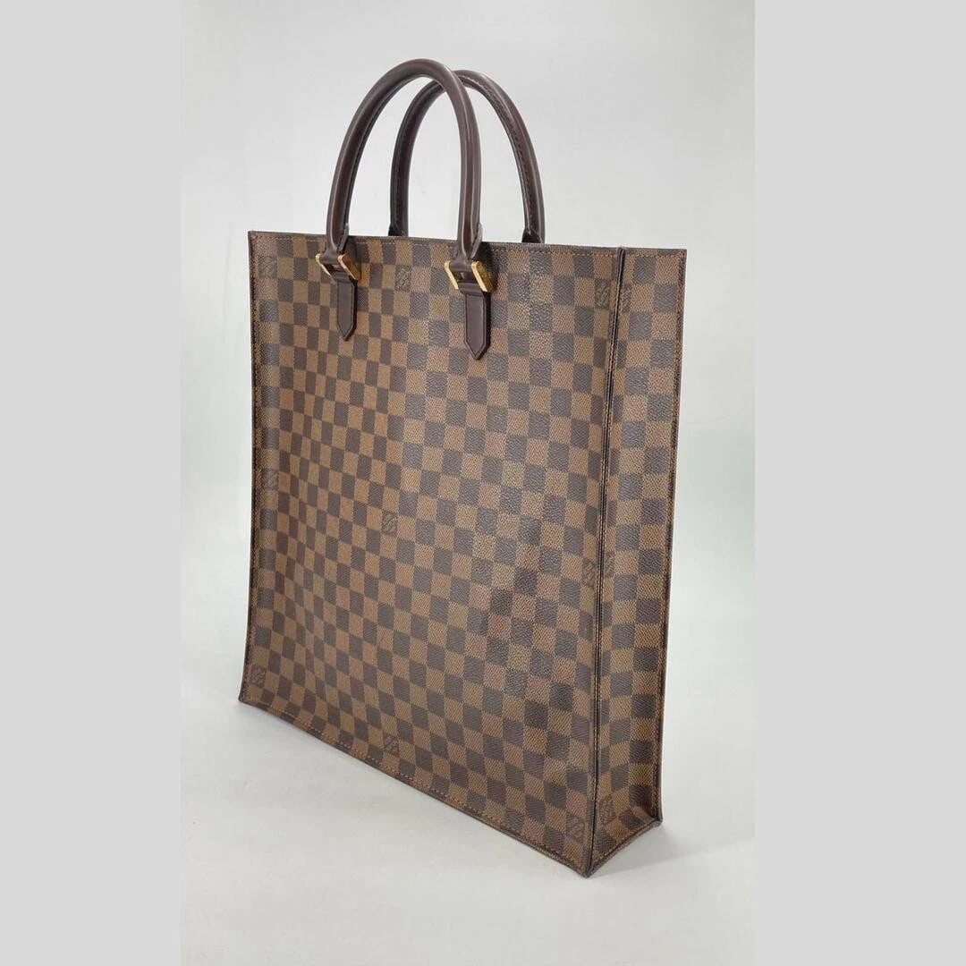 LOUIS VUITTON HANDBAG SAC PLI VUITTON DAMIER CANVAS: Louis Vuitton Handbag Sac Pli Vuitton Damier Canvas Brand: Louis Vuitton Type/Style: Bag Material: Canvas with Leather accents Color: Damier Canvas (Brown and Beige) Size: approximate diions of 38 cm 