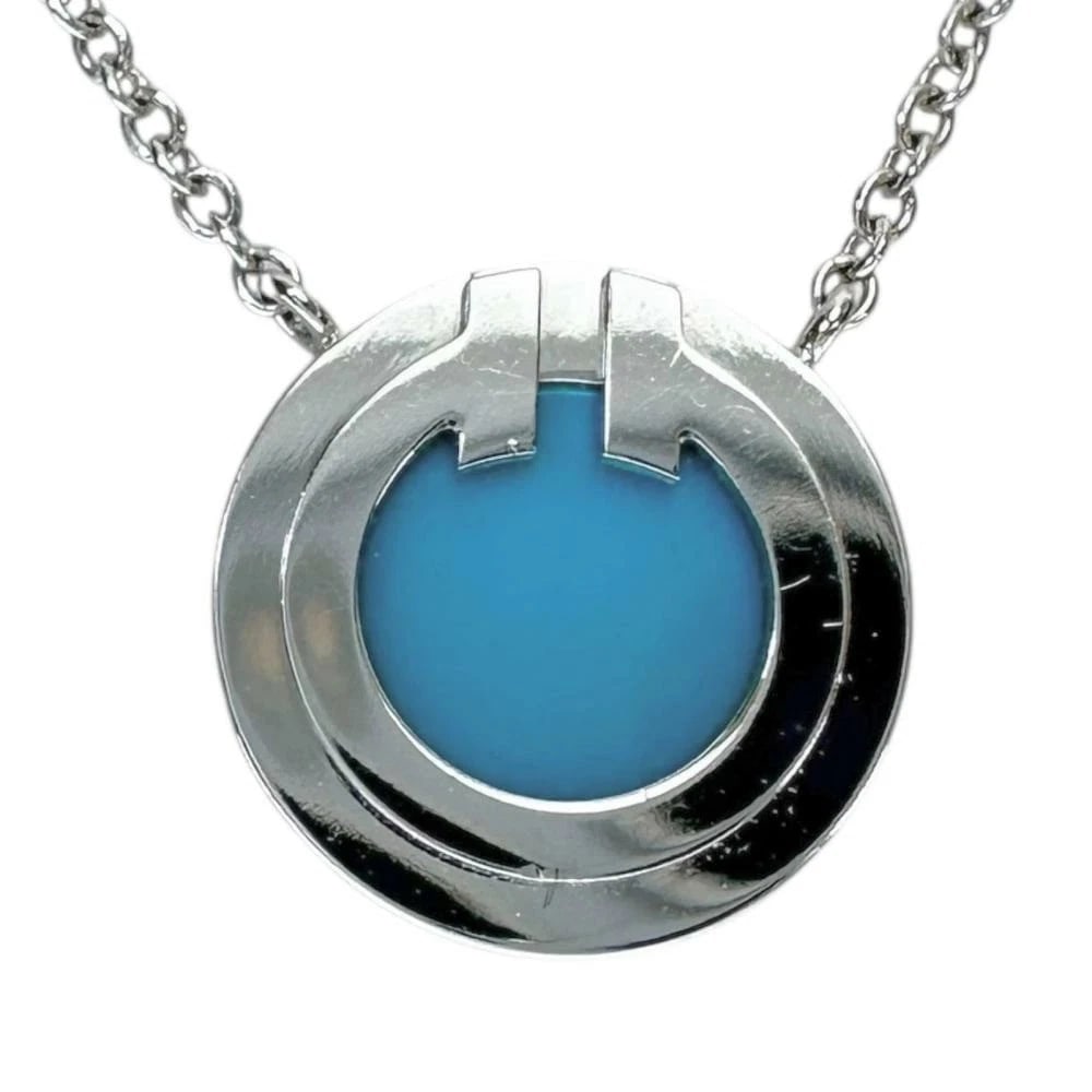 AUTHENTIC TIFFANY & CO. T TWO CIRCLE TURQUOISE NECKLACE: Authentic Tiffany & Co. T Two Circle Turquoise Necklace Brand: Tiffany & Co. Type/Style: Necklace Material: 18K White Gold, Main Stone/Creation Turquoise Color: WG Size: Chain Length: Approx.