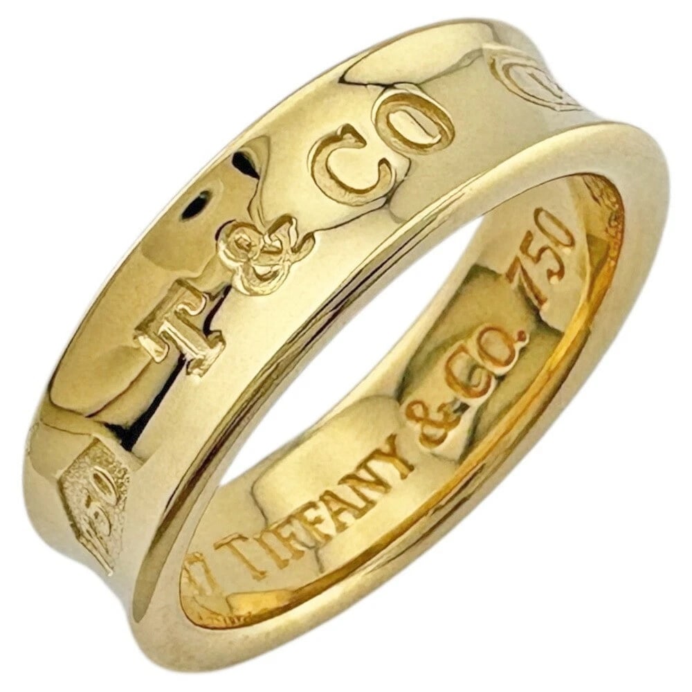 TIFFANY & CO. NARROW RING: Tiffany & Co. Narrow Ring Brand: Tiffany & Co. Type/Style: Ring Material: K18 Yellow Gold Color: YG Size: US 7.5 Accessories: None Accessories Notice: When purchasing pre-owned goods, please refer to