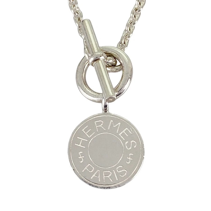HERMES SELLIER AMULET SILVER NECKLACE: HERMES Sellier Amulet Silver Necklace Brand: HERMES Type/Style: Necklace Material: Silver 925, Color: Silver Size: Top size:14.0mm Necklace full length:40cm Accessories: None Accessories Notice: When