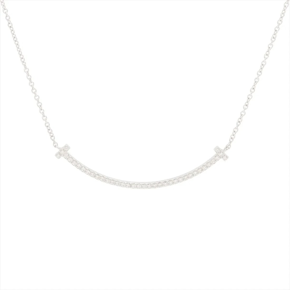 TIFFANY T SMILE SMALL DIAMOND NECKLACE 750(WG): Tiffany T Smile Small diamond Necklace 750(WG) Brand: Tiffany Type/Style: Necklace Material: 750(WG), Main Stone/Creation Natural Color: WG Size: (CM) Chain length:51.1 Accessories: None Accessories