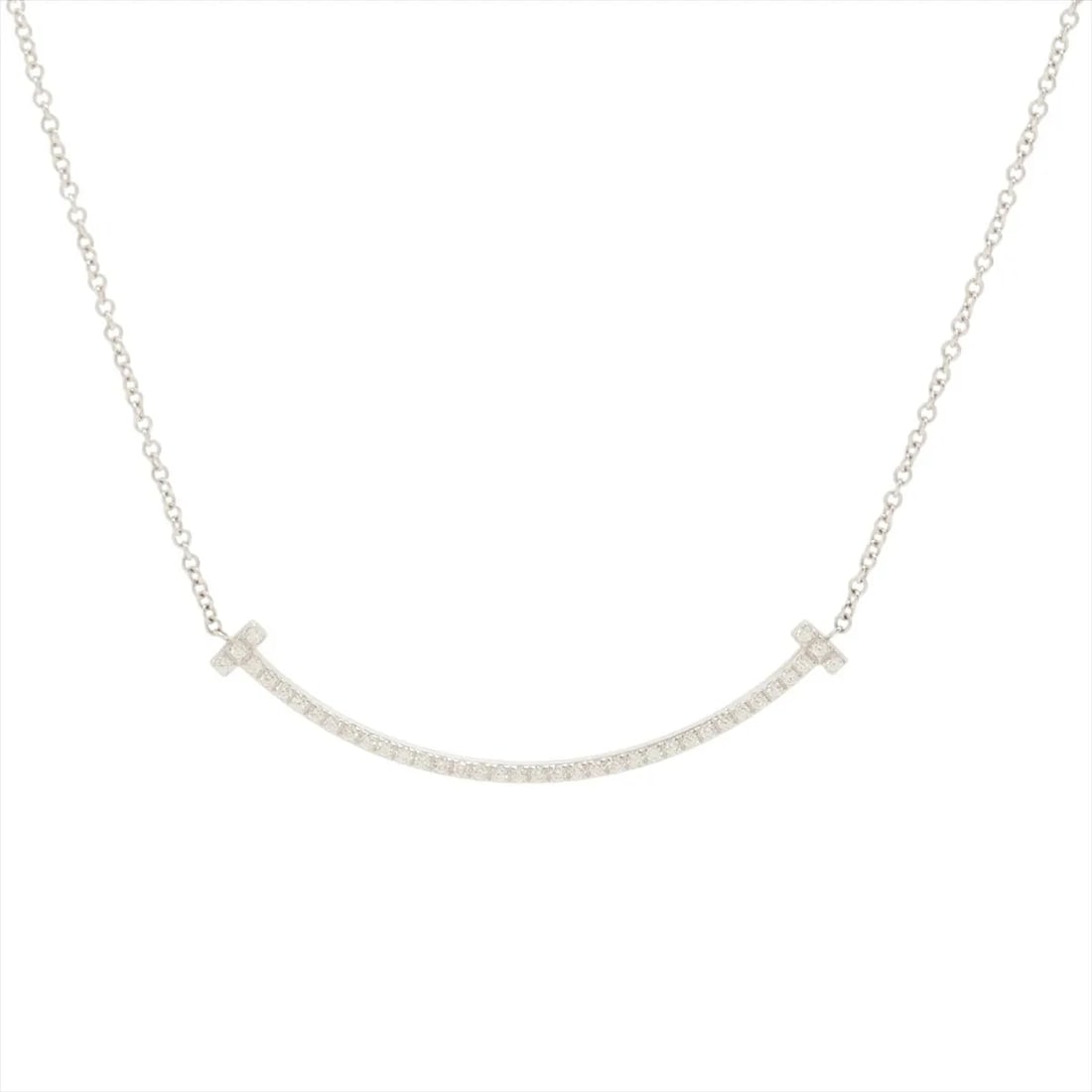 TIFFANY T SMILE SMALL DIAMOND NECKLACE 750(WG): Tiffany T Smile Small diamond Necklace 750(WG) Brand: Tiffany Type/Style: Necklace Material: 750(WG), Main Stone/Creation Natural Color: WG Size: (CM) Chain length:40.9 Accessories: None Accessories