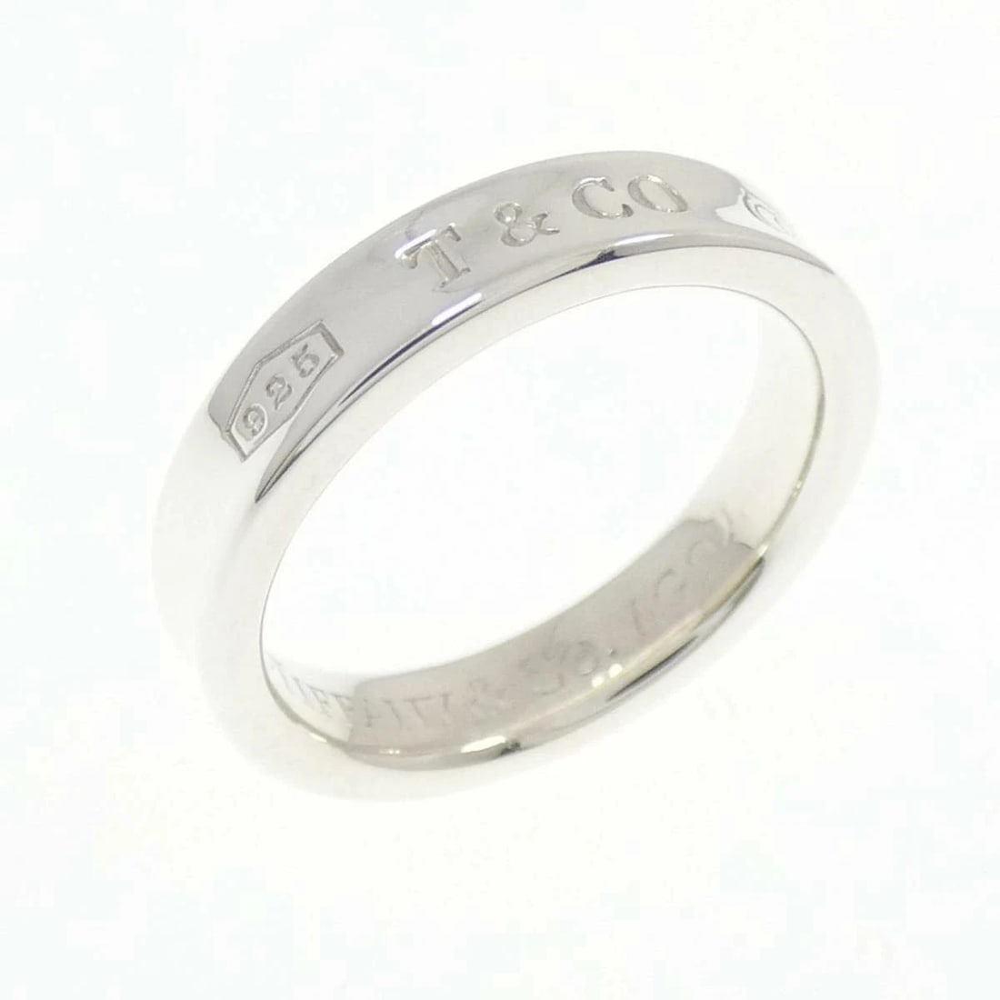 TIFFANY NARROW SILVER RING: Tiffany Narrow Silver Ring Brand: Tiffany & Co. Type/Style: Ring Material: SV925, Color: Silver Size: US 5 Accessories: None Accessories Notice: When purchasing pre-owned goods, please refer to the