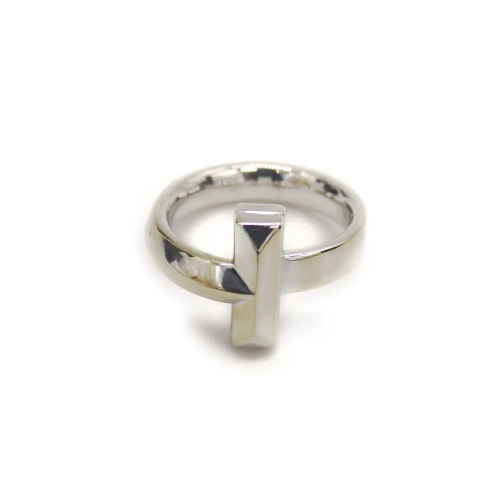 TIFFANY & CO. 18KWG T ONE RING WHITE GOLD: Tiffany & Co. 18KWG T One Ring White Gold Brand: Tiffany & Co. Type/Style: Ring Material: K18WG, Color: WG Size: US 5.5 Accessories: None Accessories Notice: When purchasing pre-owned good