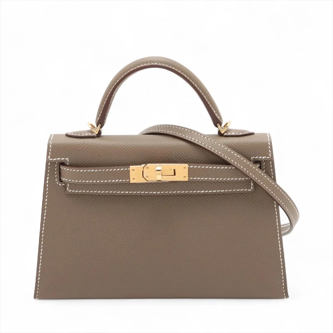 HERMES MINI KELLY 2 20 SERIE VEAU EPSOM ETOUPE: Hermes mini kelly 2 20 Serie Veau Epsom Etoupe Brand: Hermes Type/Style: Hand bag Material: Veau Epsom Color: Etoupe Size: Height:4.9inchLength:7.5inchDepth:2.2inch Accessories: None Acces