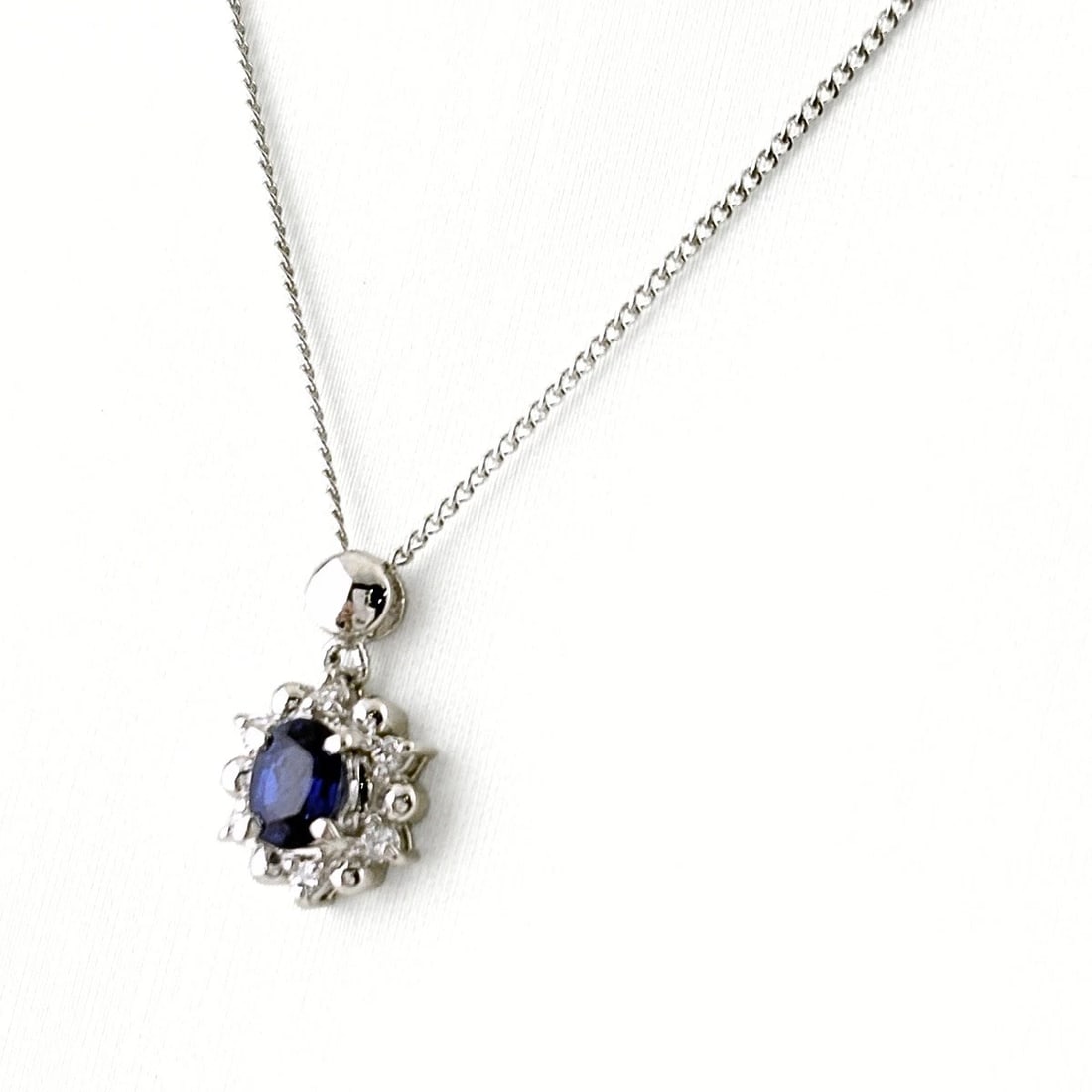 SAPPHIRE DESIGN NECKLACE PLATINUM PENDANT: Sapphire design necklace Platinum Pendant Brand: Unbranded Type/Style: Necklace Material: Pt900, Main Stone Sapphire Color: PT Size: Chain / code 39.5cm(15.6") Total length of the pendant head includi