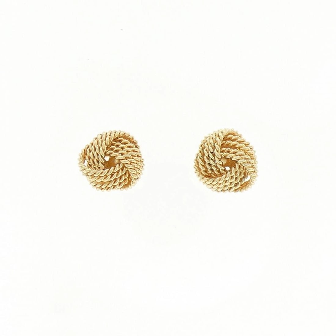 TIFFANY&CO. TWIST KNOT PIERCINGS: TIFFANY&Co. Twist Knot Piercings Brand: TIFFANY&Co. Type/Style: TIFFANY&Co. Pierce/Earring Material: 750 yellow gold, Color: yellow gold Size: Actual Size Approx. height x width: 8.9mm x 9.7mm