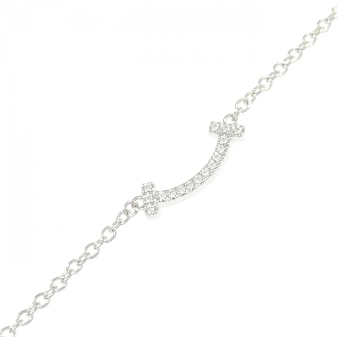 TIFFANY & CO. T SMILE MINI BRACELET: TIFFANY & Co. T Smile Mini Bracelet Brand: TIFFANY&Co. Type/Style: TIFFANY & Co. Bracelet Material: 750 white gold, Main Stone natural Color: White Gold Size: Length 16.5?18cm Actual Size Max width