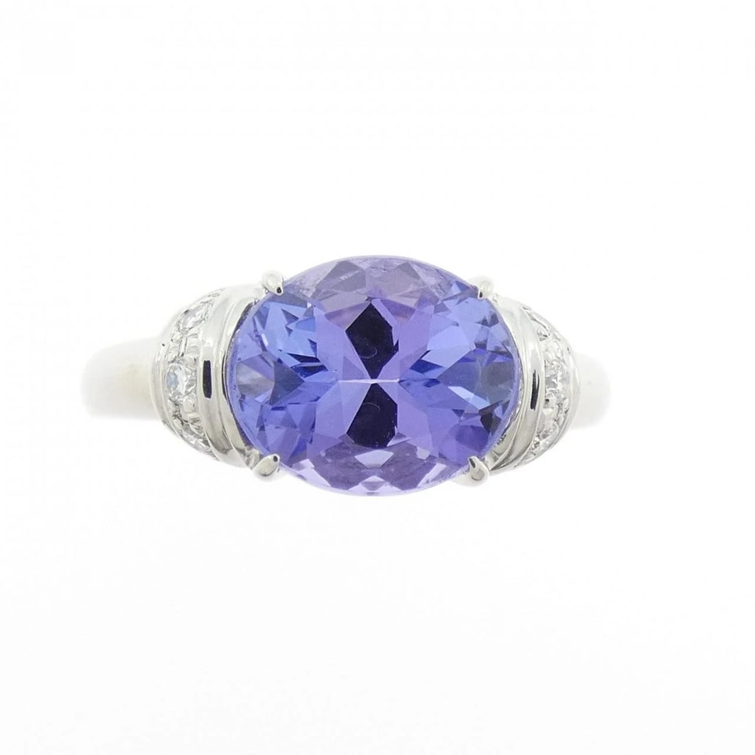 PT900 TANZANITE RING: PT900 Tanzanite Ring Brand: Unbranded Type/Style: Tanzanite Ring Material: PT900, Main Stone Tanzanite Secondary Stone Diamond Color: Silver Size: US 6 1/2 Accessories: None Accessories Notice: When