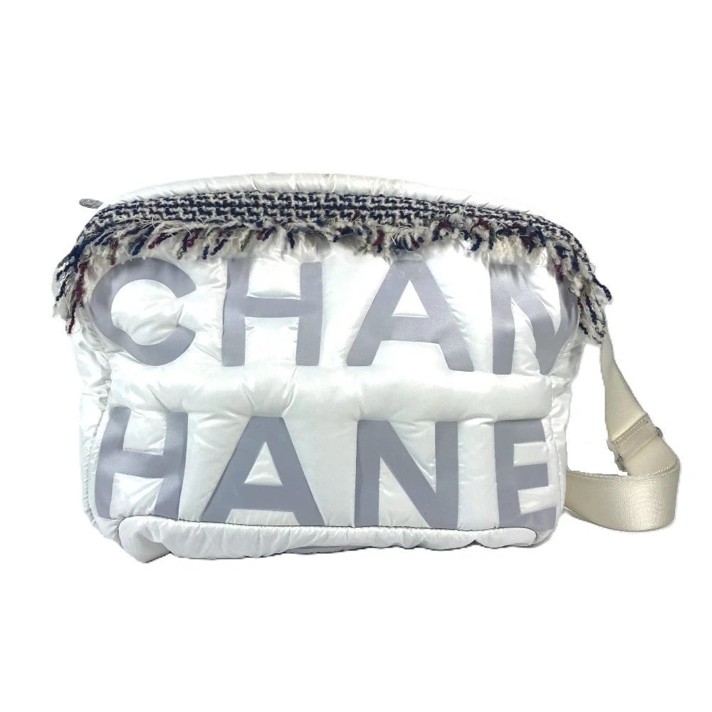 CHANEL FRINGE COCONEIGE LOGO CROSSBODY SHOULDER BAG NYLON WHITE: CHANEL fringe CocoNeige Logo Crossbody Shoulder Bag Nylon White Brand: CHANEL Type/Style: Shoulder Bag Material: Nylon Color: White Size: W13.6?H10.6?D2.8inch / W34.5cm?H27cm?D7cm Accessories: Non
