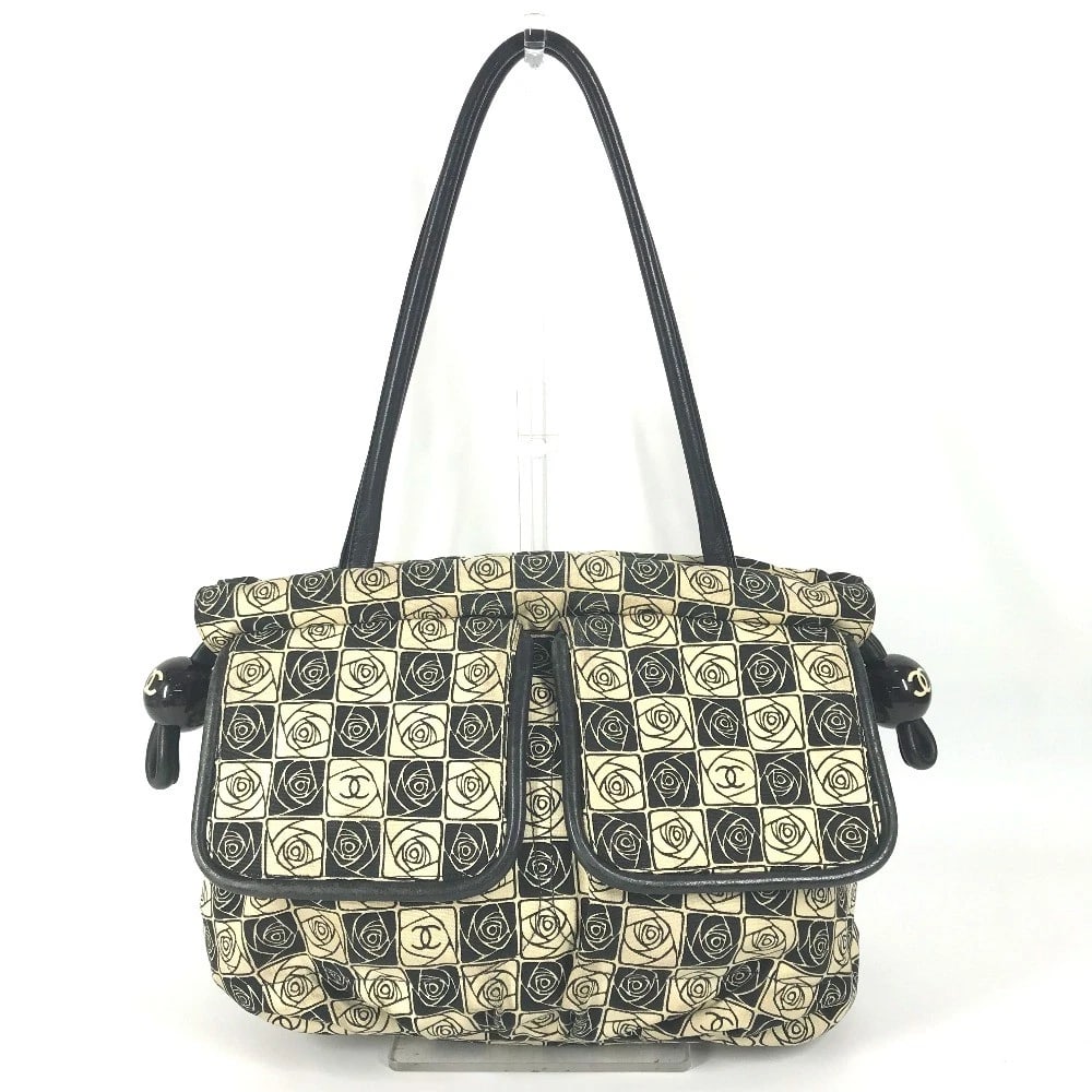 CHANEL COCO BALL CAMELLIA SHOULDER BAG: CHANEL Coco ball Camellia Shoulder Bag Brand: CHANEL Type/Style: Shoulder Bag Material: Canvas Color: BlackxWhite Size: W13.8?H9.8?D4.7inch / W35cm?H25cm?D12cm Accessories: None Accessorie