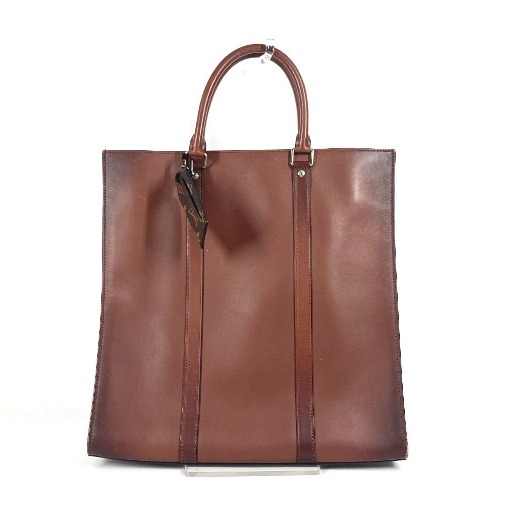 LOUIS VUITTON NOMAD SAC PLAT BAG TOTE BAG HAND BAG: LOUIS VUITTON Nomad Sac Plat Bag Tote Bag Hand Bag Brand: LOUIS VUITTON Type/Style: Business bag Material: Nomad leather Color: Brown Size: W14.0?H13.8?D3.3inch / W35.5cm?H35cm?D8.5cm Accessories: