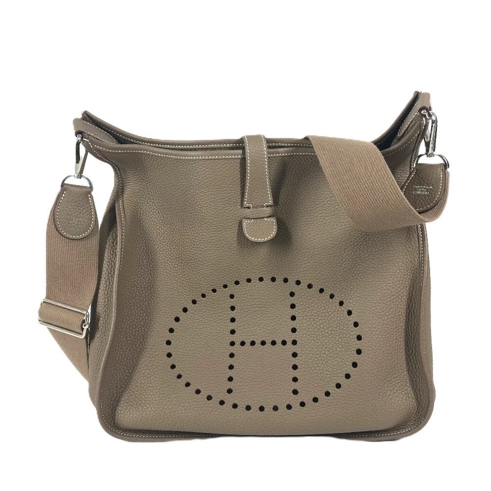 HERMES EVELYNE CROSSBODY SHOULDER BAG TAURILLON CLEMENCE ETOUPE: HERMES Evelyne crossbody Shoulder Bag Taurillon Clemence Etoupe Brand: HERMES Type/Style: Shoulder Bag Material: Taurillon Clemence Color: BeigexSilverHardware Size: W12.6?H12.2?D3.1inch / W32cm?H31cm