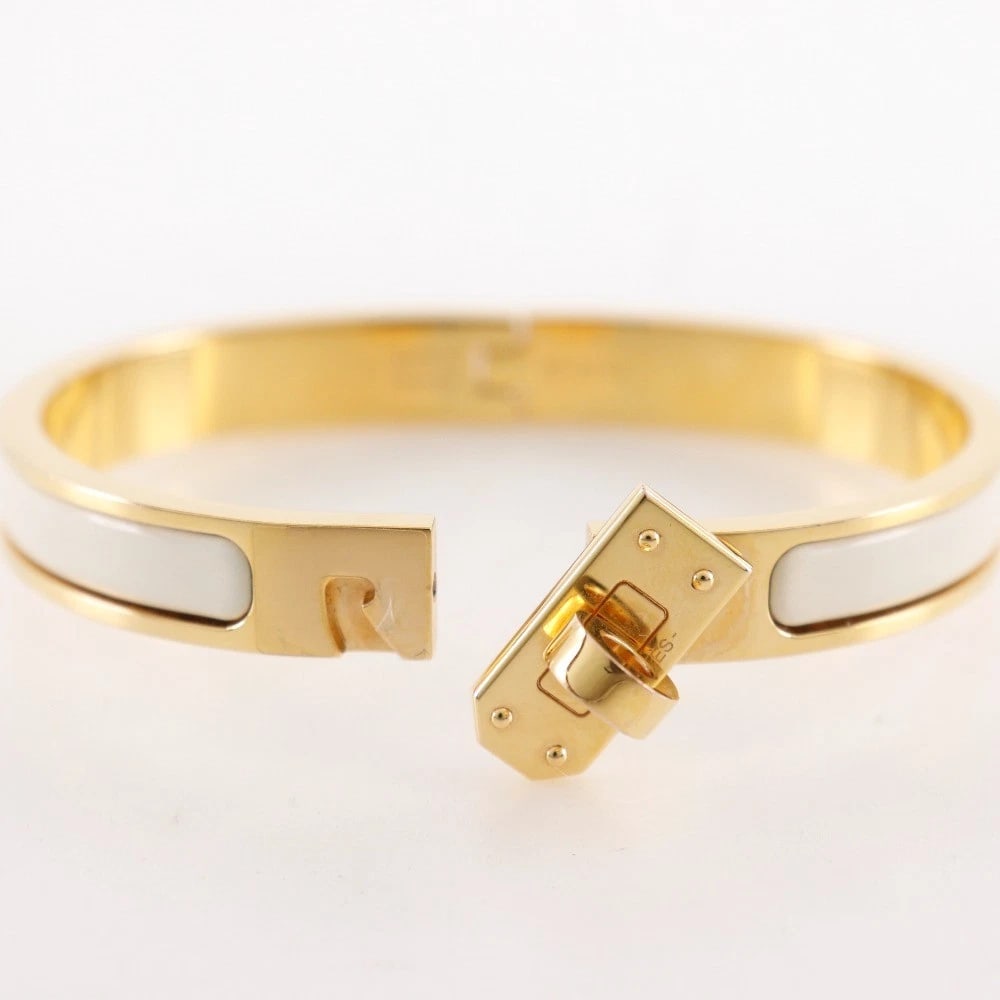 HERMES MINI CLICK KELLY BANGLE/CLAIM PLATED GOLD/ENAMEL: HERMES Mini Click Kelly Bangle/claim Plated Gold/enamel Brand: HERMES Type/Style: Bangle Material: Plated Gold, Color: claim Size: (CM) Wrist circumference?15cm Bracelet width?8.3cm Accessories: N