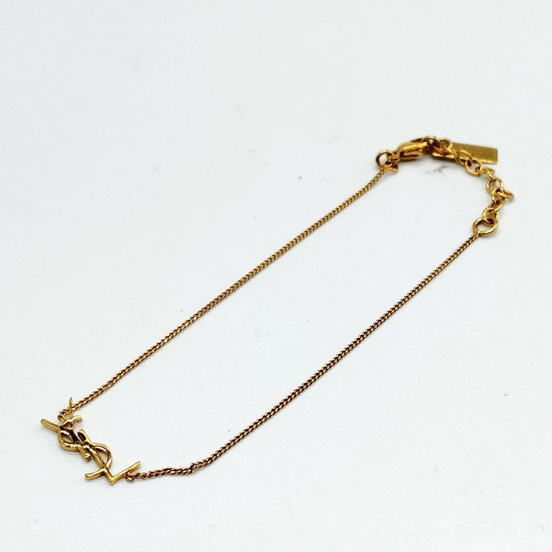 SAINT LAURENT BRACELET GOLD: Saint Laurent Bracelet Gold Brand: Unbranded Type/Style: Bracelet Material: Metal, Color: Gold Size: Length : 20 cm (approx) Accessories: None Accessories Notice: When purchasing pre-owned