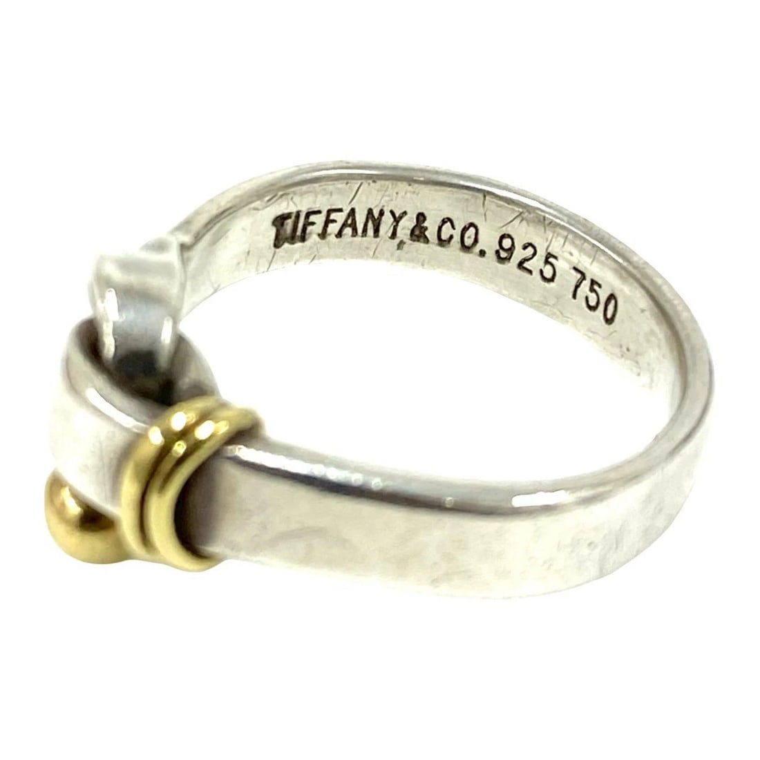 TIFFANY & CO. TIFFANY LOVE KNOT RING: Tiffany & Co. Tiffany Love Knot Ring Brand: Tiffany & Co. Type/Style: Ring Material: SV925 K18YG, Color: Silver YG Size: 4.75 - 5 US Accessories: None Accessories Notice: When purchasing pre-owned