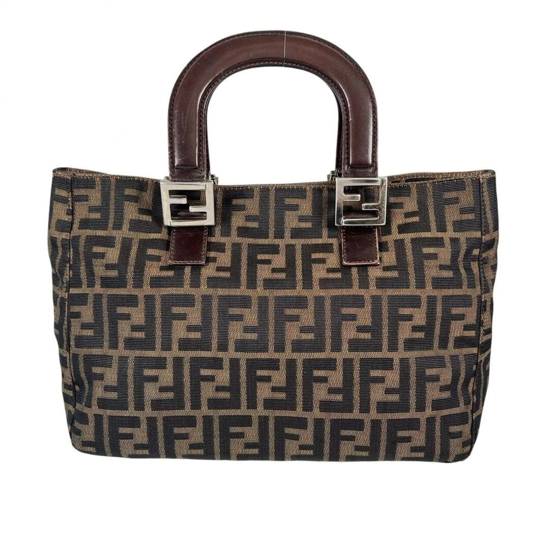 FENDI CANVAS HANDBAG BROWN: FENDI Canvas Handbag Brown Brand: FENDI Type/Style: Bag Material: Canvas Color: Brown Size: Approximately 38 cm (15 in) W x 22 cm (8.7 in) H x 12 cm (4.7 in) D Accessories: None Accessorie