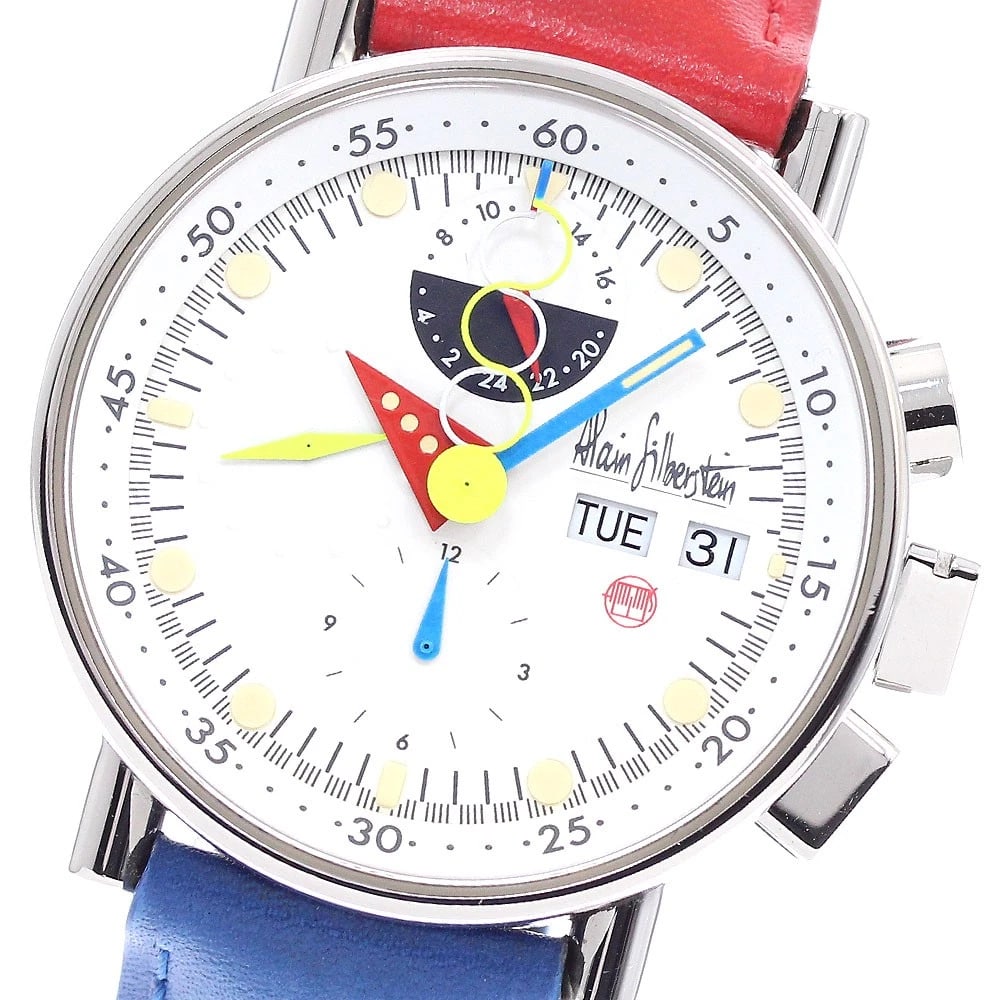 ALAIN SILBERSTEIN CHRONO BAUHAUS DAY AM/PM AUTOMATIC WATCH: Alain Silberstein Chrono Bauhaus Day AM/PM Automatic Watch Brand: Alain Silberstein Type/Style: Wristwatch Material: Band Material leather, Case Material Stainless Steel Color: Band Color Red / blue,