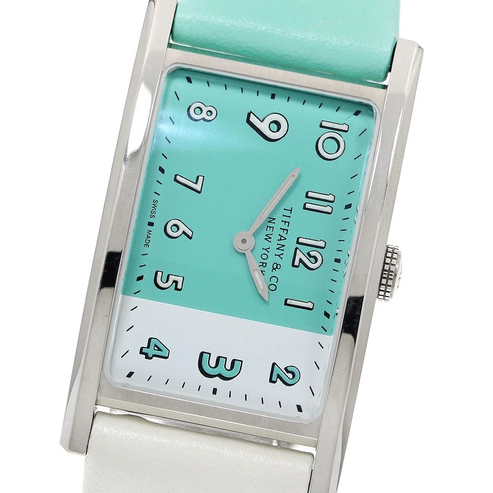 TIFFANY&CO. EAST WEST BAND QUARTZ WATCH: TIFFANY&Co. East West Band Quartz Watch Brand: TIFFANY&Co. Type/Style: Wristwatch Material: Band Material leather, Case Material Stainless Steel Color: Band Color Blue / White, Case Color Silver, Dial