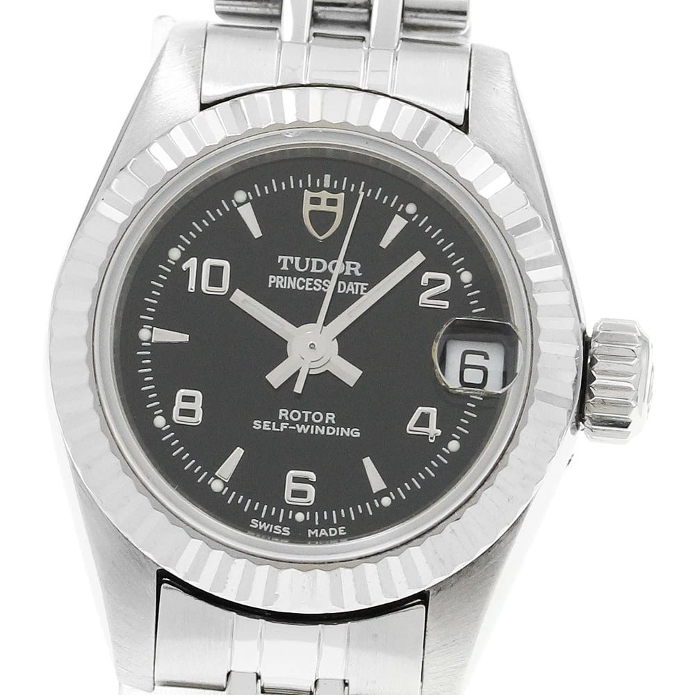 TUDOR PRINCESS WG BEZEL WATCH: TUDOR Princess WG Bezel Watch Brand: TUDOR Type/Style: Wristwatch Material: Band Material Stainless Steel, Case Material Stainless Steel/WG Color: Band Color Silver, Case Color Silver, Dial Color blac