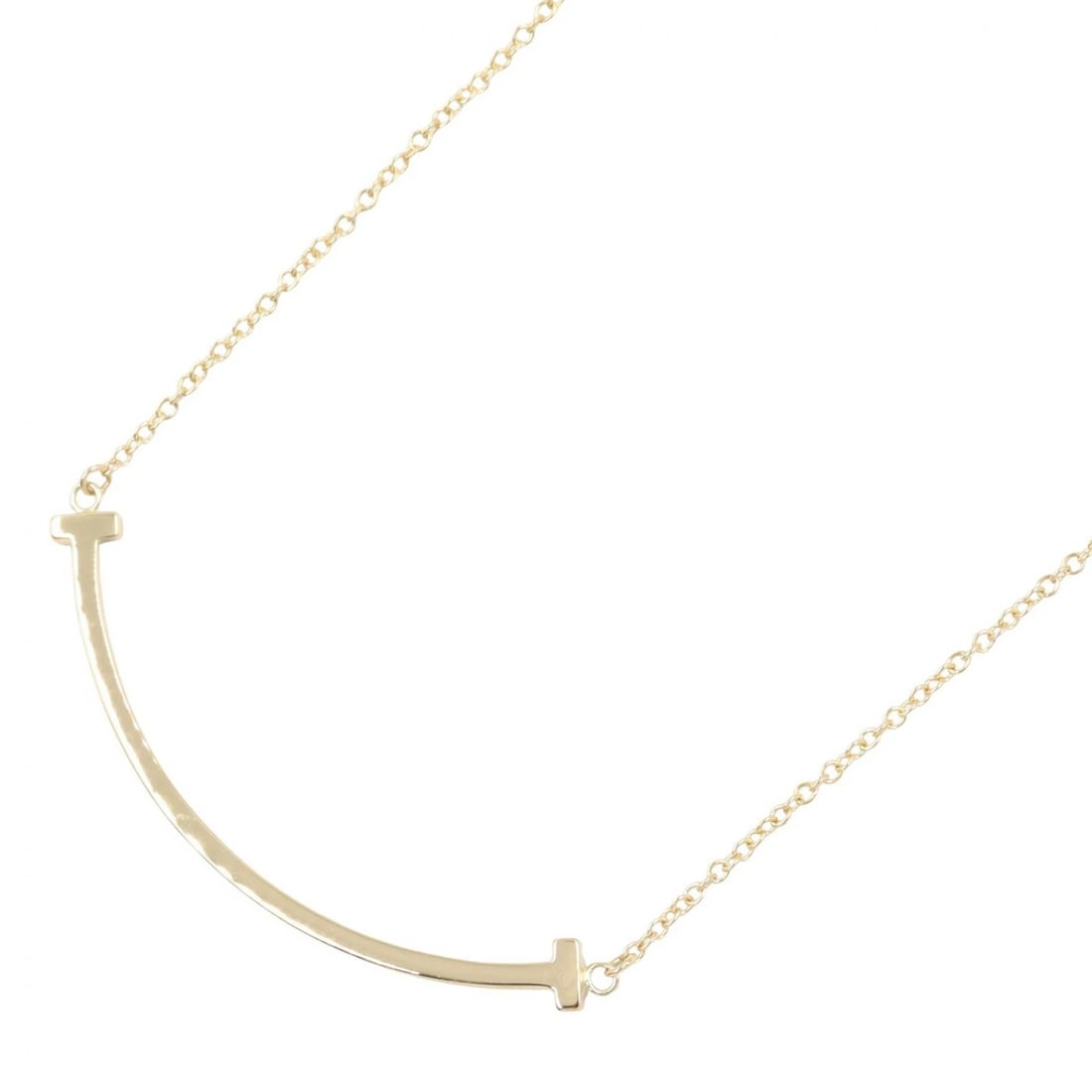 TIFFANY?CO T SMILE SMALL NECKLACE 18K YELLOW GOLD: TIFFANY?CO T Smile Small Necklace 18K Yellow Gold Brand: TIFFANY?CO Type/Style: Necklace Material: K18 (Yellow Gold) Color: Gold Size: Neck rotation?40.5/45.5cm(15.9") Motif W?37mm x H?3mm(1.5" x 0.1"