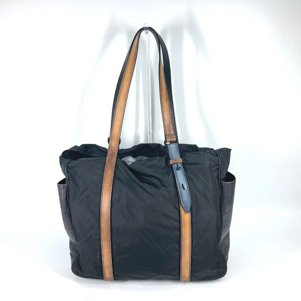 BERLUTI SHOULDER CHILLOUT CALLIGRAPHY SHOULDER BAG BAG: Berluti Shoulder chillout calligraphy Shoulder Bag Bag Brand: Berluti Type/Style: Tote Bag Material: Nylon / Leather Color: Black / Brown Size: W15.0?H12.8?D5.9inch / W38cm H32.5cm D15cm Accessories: