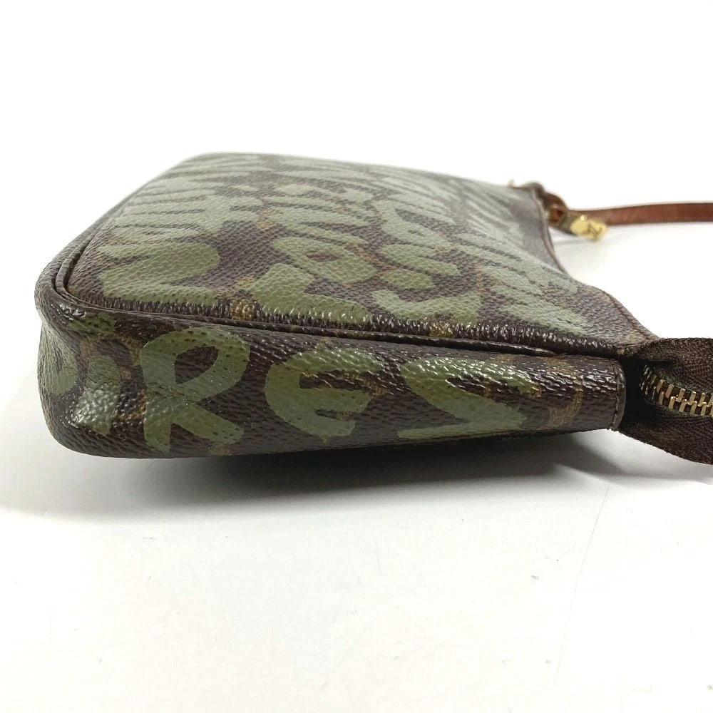 LOUIS VUITTON MONOGRAMGRAFFITI POCHETTE-ACCESSOIRES POUCH: LOUIS VUITTON MonogramGraffiti Pochette-Accessoires Pouch Brand: Louis Vuitton Type/Style: Shoulder Bag Material: Monogram Graphite Canvas Color: khaki/Brown Size: W7.9?H4.9?D1.2inch / W20cm H12.5cm D