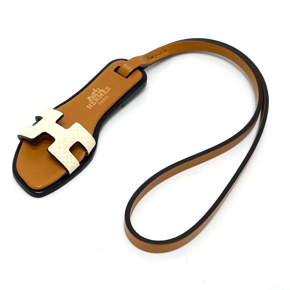 UNHERMES ORAN NANO BAG CHARM EPSOM: UNHERMES Oran Nano Bag Charm Epsom Brand: HERMES Type/Style: charm Material: Epsom Color: Brown Size: Total Length: 9.6inch / 24.5cm Accessories: None Accessories Notice: When purchasing p