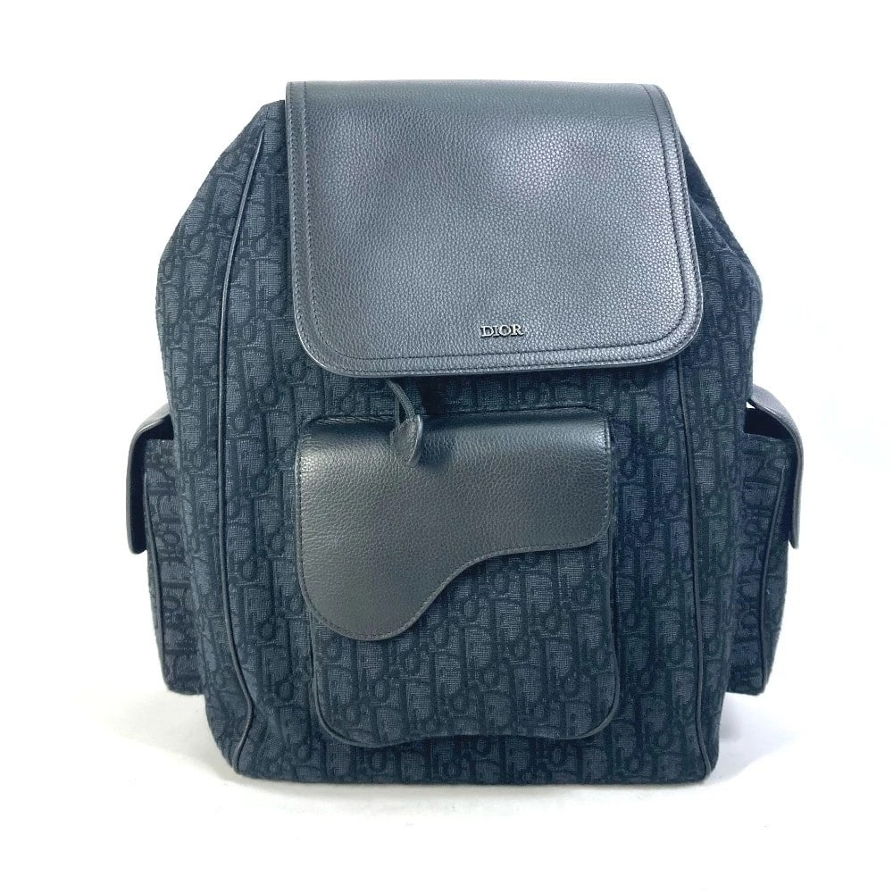 DIOR SADDLE OBLIQUE BACKPACK CANVAS/LEATHER: Dior Saddle Oblique Backpack Canvas/Leather Brand: Dior Type/Style: Backpack Material: Canvas/Leather Color: NavyxBlack Size: W10.0?H16.1?D5.9inch / W25.5cm H41cm D15cm Accessories: None A