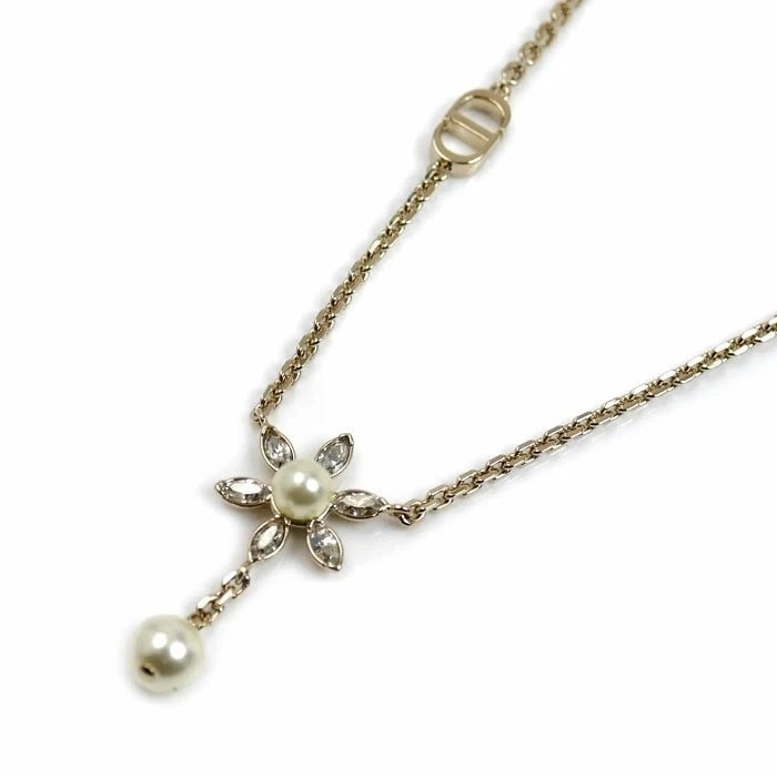 CHRISTIAN DIOR BLOOM IN DIOR NECKLACE: Christian Dior Bloom in Dior Necklace Brand: Dior Type/Style: Necklace Material: Metal, Main Stone/Creation Crystal Color: None Size: Necklace Length: Approx. 16.9 in Pendant Size: Approx. 0.48 ?