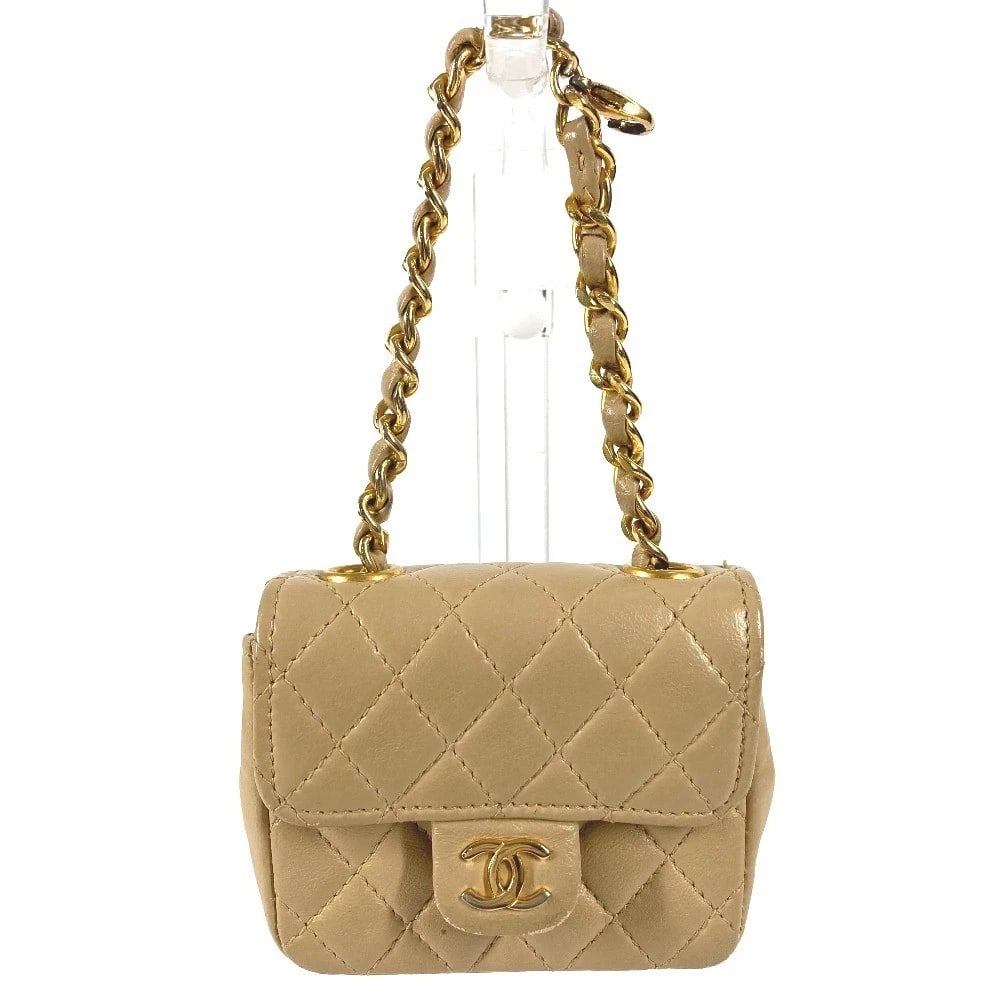 CHANEL QUILTED CC LOGO MINI MATELASSE POUCH: CHANEL Quilted CC logo Mini Matelasse Pouch Brand: CHANEL Type/Style: Hand Bag Material: Lambskin Leather Color: Beige/GoldHardware Size: W3.3?H2.8inch / W8.5cm H7cm Accessories: None Acce