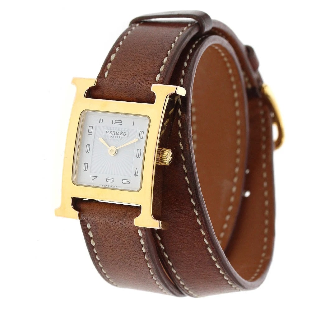 HERMES WATCH WHITE QUARTZ WATCH: HERMES watch White Quartz Watch Brand: HERMES Type/Style: Wristwatch Material: Band Material leather, Case Material Stainless Steel/Gold Plated Color: Dial Color white Size: Case size About 21mm